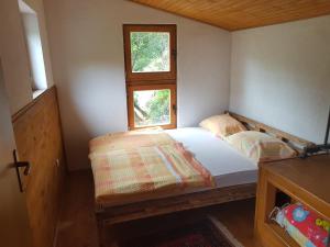Un ou plusieurs lits dans un hébergement de l'établissement Potok kuca sa bazenom