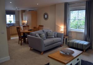 a living room with a couch and a table at Cara Anan in Killin