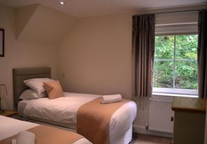 Ένα ή περισσότερα κρεβάτια σε δωμάτιο στο Gleann Fia House