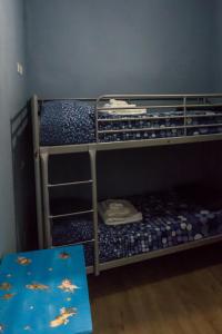 Двухъярусная кровать или двухъярусные кровати в номере Lo Specchio