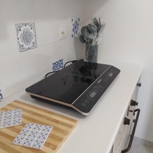 a laptop sitting on top of a kitchen counter at La casetta con cortile in Lecce