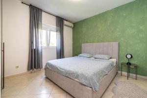 Postel nebo postele na pokoji v ubytování Villa Helena Rovanjska