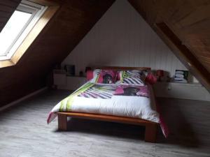 Un pat sau paturi într-o cameră la Vacances au calme