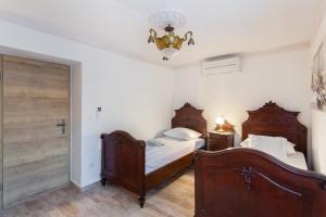 Łóżko lub łóżka w pokoju w obiekcie Villa Dunatić
