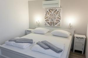Łóżko lub łóżka w pokoju w obiekcie Villa Dunatić