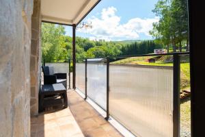 a screened in porch with a view of the water at Apartamenty Admirał  in Solina
