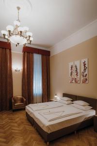 Postel nebo postele na pokoji v ubytování Dózsa Apartman Szeged