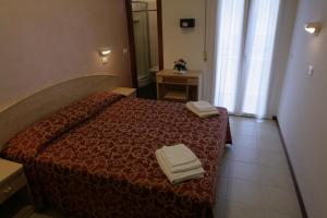 Postel nebo postele na pokoji v ubytování Hotel Belmar