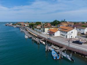 an aerial view of a dock with boats in the water at Borgo Levante Camere in Porto Viro