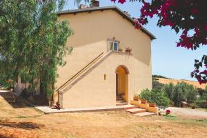 a smallchurch with a door and stairs in front of it at Agriturismo Morani in Santa Severa
