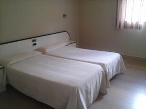Posteľ alebo postele v izbe v ubytovaní Hotel Aguadoce - Louzao