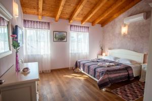 Postel nebo postele na pokoji v ubytování Villa Pavicini 2181