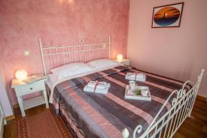 Postel nebo postele na pokoji v ubytování Villa Pavicini 2181
