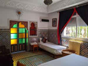 Ένα ή περισσότερα κρεβάτια σε δωμάτιο στο Malabata Guest House