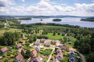 an aerial view of a house with a lake at Apartmány Karlovy Dvory in Horní Planá