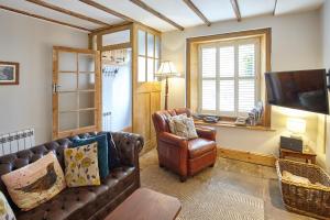 a living room with a couch and a chair at North England - North Pennines AONB in Westgate