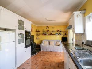 Kuchyň nebo kuchyňský kout v ubytování Carriganna Cottage