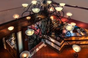a chandelier with many lights in a room at Kallisti Hotel in Potos
