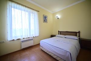 Кровать или кровати в номере Sevan Tarsus Guesthouse