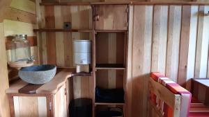 a wooden bathroom with a sink and a counter at Caban'Aspe in Accous