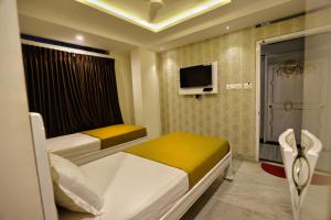 Voodi või voodid majutusasutuse Hotel City Meridian toas