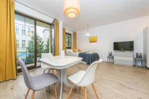 TV a/nebo společenská místnost v ubytování Pomorskie Apartamenty Baltic House