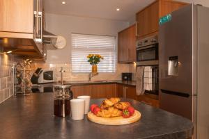 a kitchen with a plate of food on a counter at 2 Park Court in Ilfracombe