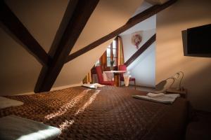 Postel nebo postele na pokoji v ubytování Minipivovar Kněžínek