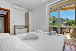 Postel nebo postele na pokoji v ubytování Apartments Marin