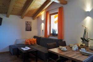a living room with a couch and a table at Haus Maiern in Ridanna