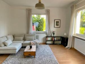 a living room with a couch and a coffee table at Villa Rosa in Bad Sachsa