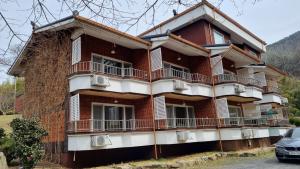 a building with balconies on the side of it at Moon-hyo House 1 in Boryeong