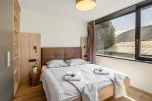 Katil atau katil-katil dalam bilik di Sunny Ferienwohnungen Ski In - Ski Out
