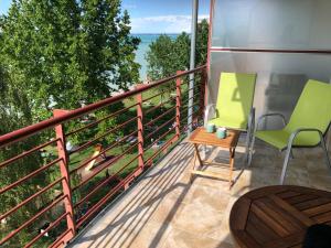 A balcony or terrace at Golden Brown Apartment