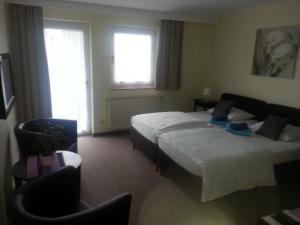 Postel nebo postele na pokoji v ubytování Hotel Gasthof am Waldeck