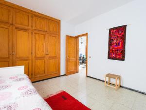 A bed or beds in a room at Agaete Pupe Home by Canariasgetaway