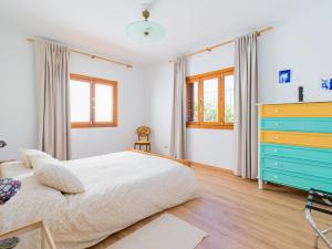 A bed or beds in a room at Agaete Pupe Home by Canariasgetaway