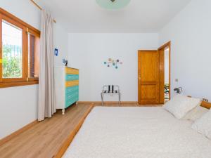 A bed or beds in a room at Agaete Pupe Home by Canariasgetaway