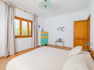 A bed or beds in a room at Agaete Pupe Home by Canariasgetaway