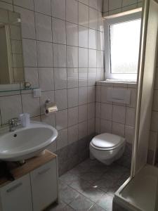 a bathroom with a sink and a toilet and a window at Studio Apartment Zen in Murine +15 photos