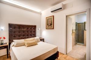 Un pat sau paturi într-o cameră la Casa Cancello