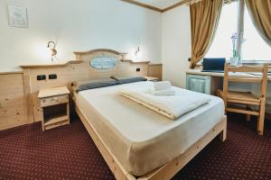 Postel nebo postele na pokoji v ubytování Hotel 2000