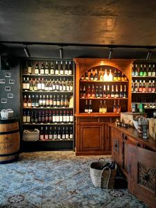 a bar with a lot of bottles of wine at Poilsio namai Žuvėdra in Nida
