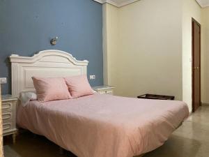 Postel nebo postele na pokoji v ubytování Hotel Medina Centro