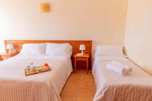 Postel nebo postele na pokoji v ubytování B&B Puerto Seguro
