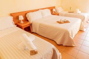 Postel nebo postele na pokoji v ubytování B&B Puerto Seguro