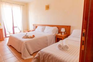 Postel nebo postele na pokoji v ubytování B&B Puerto Seguro