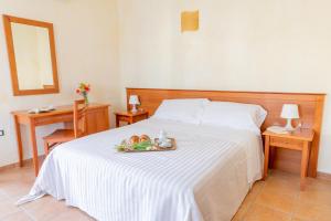 Postel nebo postele na pokoji v ubytování B&B Puerto Seguro