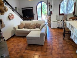 a living room with a couch and a table at Daddos in Flumini di Quartu