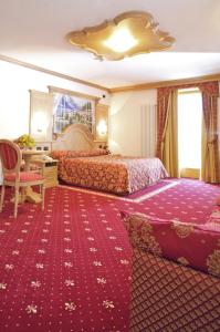 Posteľ alebo postele v izbe v ubytovaní Hotel Almazzago